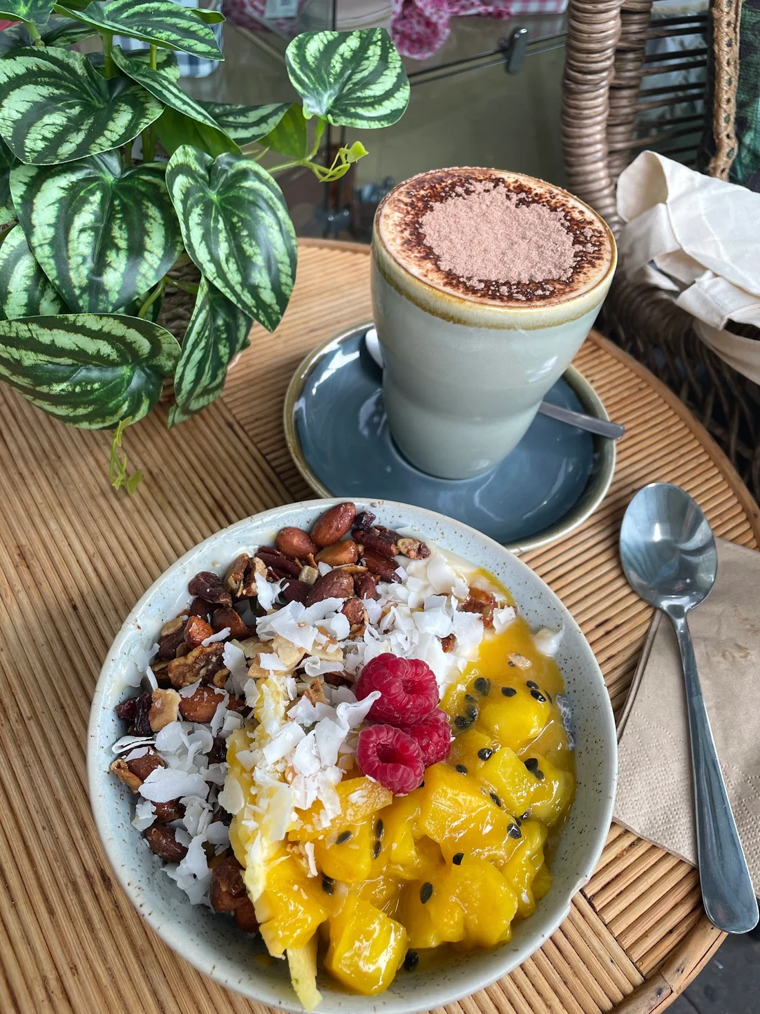 A fruit-topped breakfast bowl and coffee at The Beach Hut